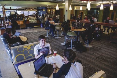 Students interacting and enjoying coffee at Jazzman's cafe and bakery in the Centennial Student Union