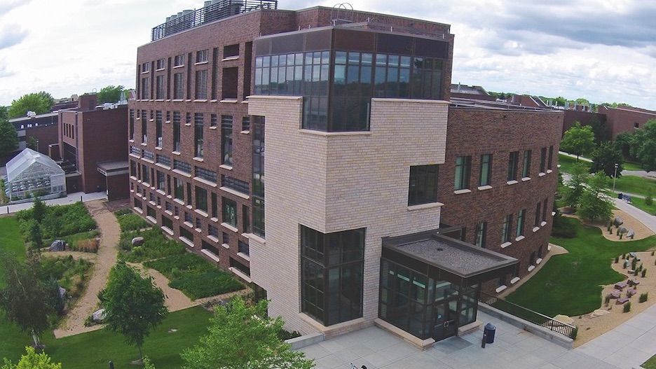 a large brick building with glass windows