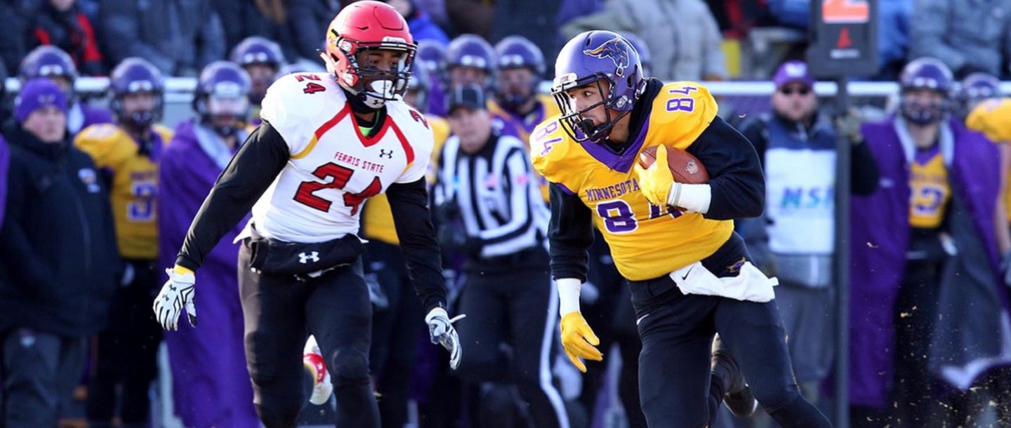 Football player running for a touchdown