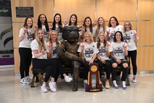 a group of women posing for a photo