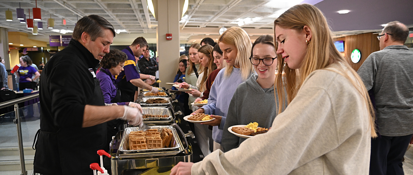 a group of people serving food