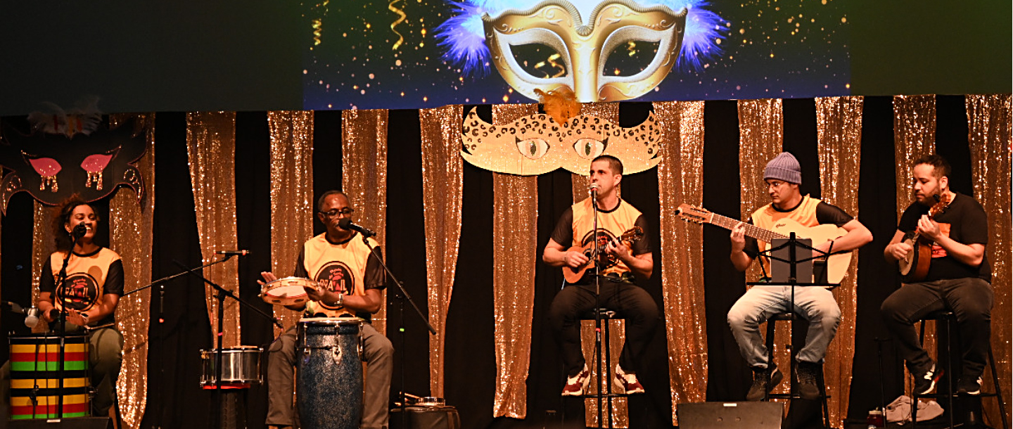 a group of men playing instruments on a stage