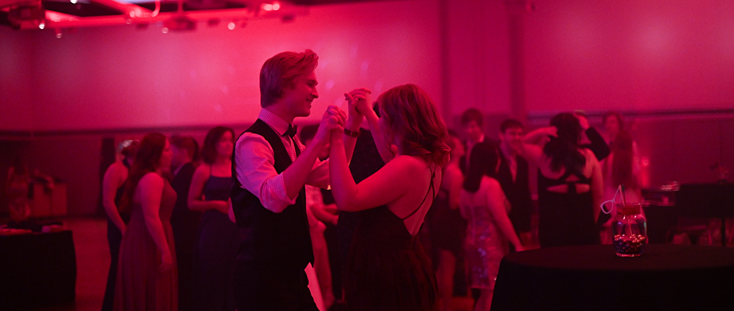 a person and person dancing in a red room