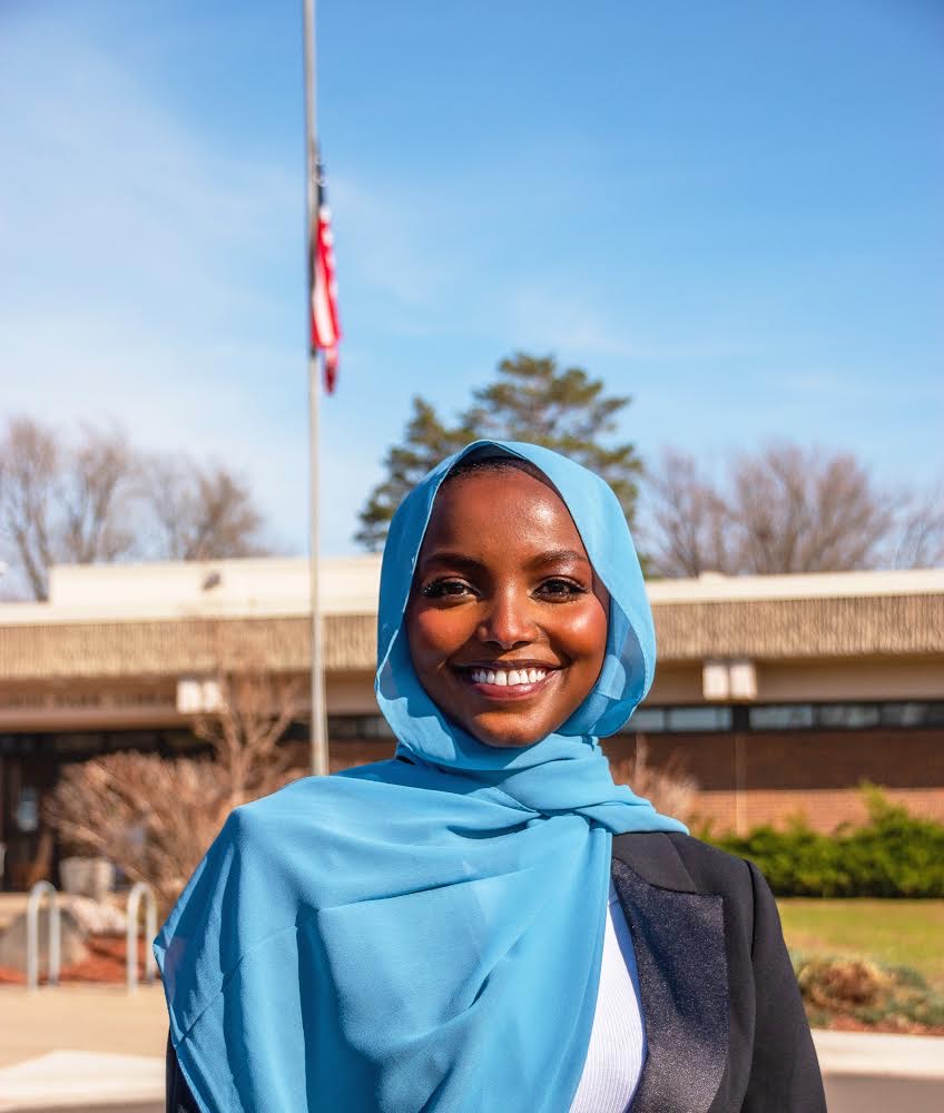 a person wearing a blue scarf