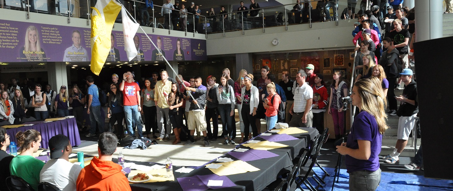 students are having food competition in front of the crowds