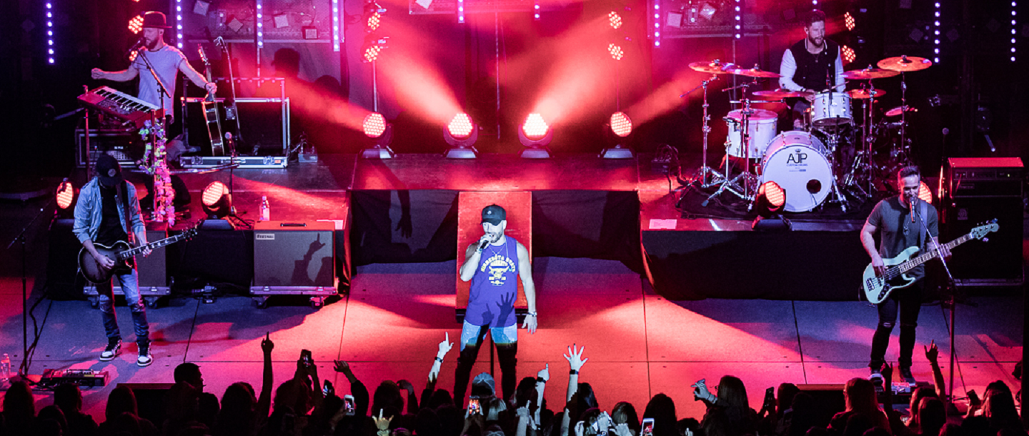 band singing in front of the crowd