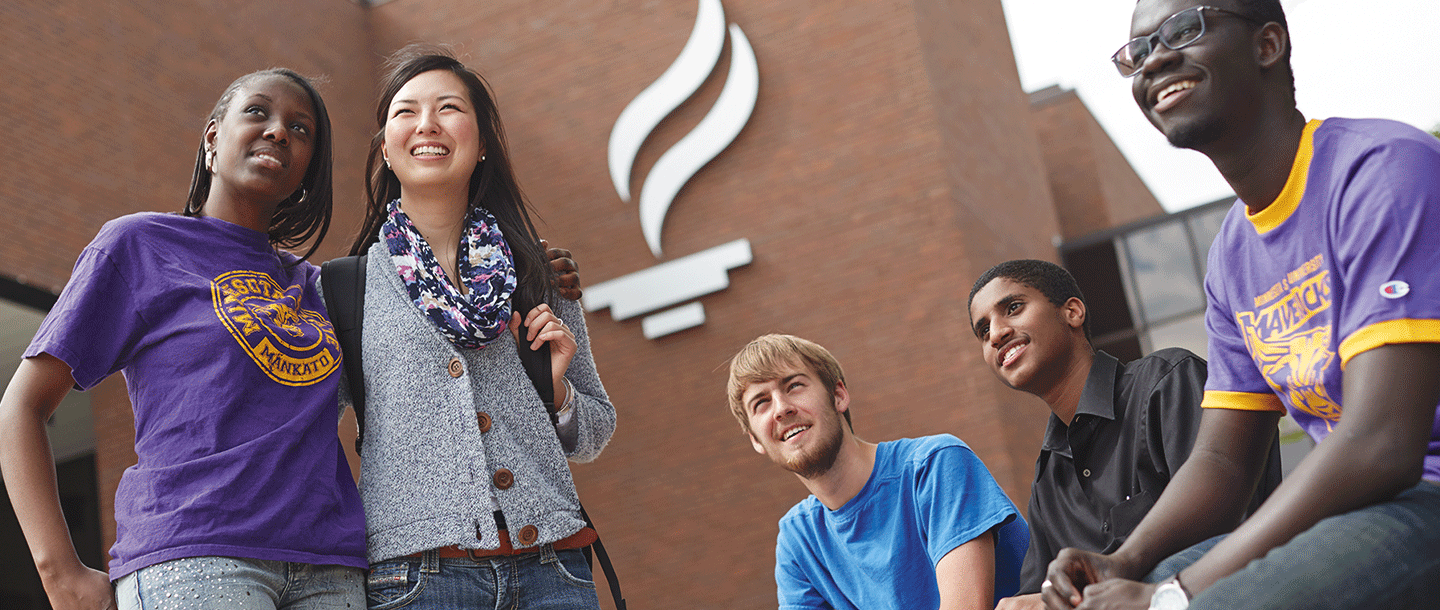 a group of people standing in front of a building