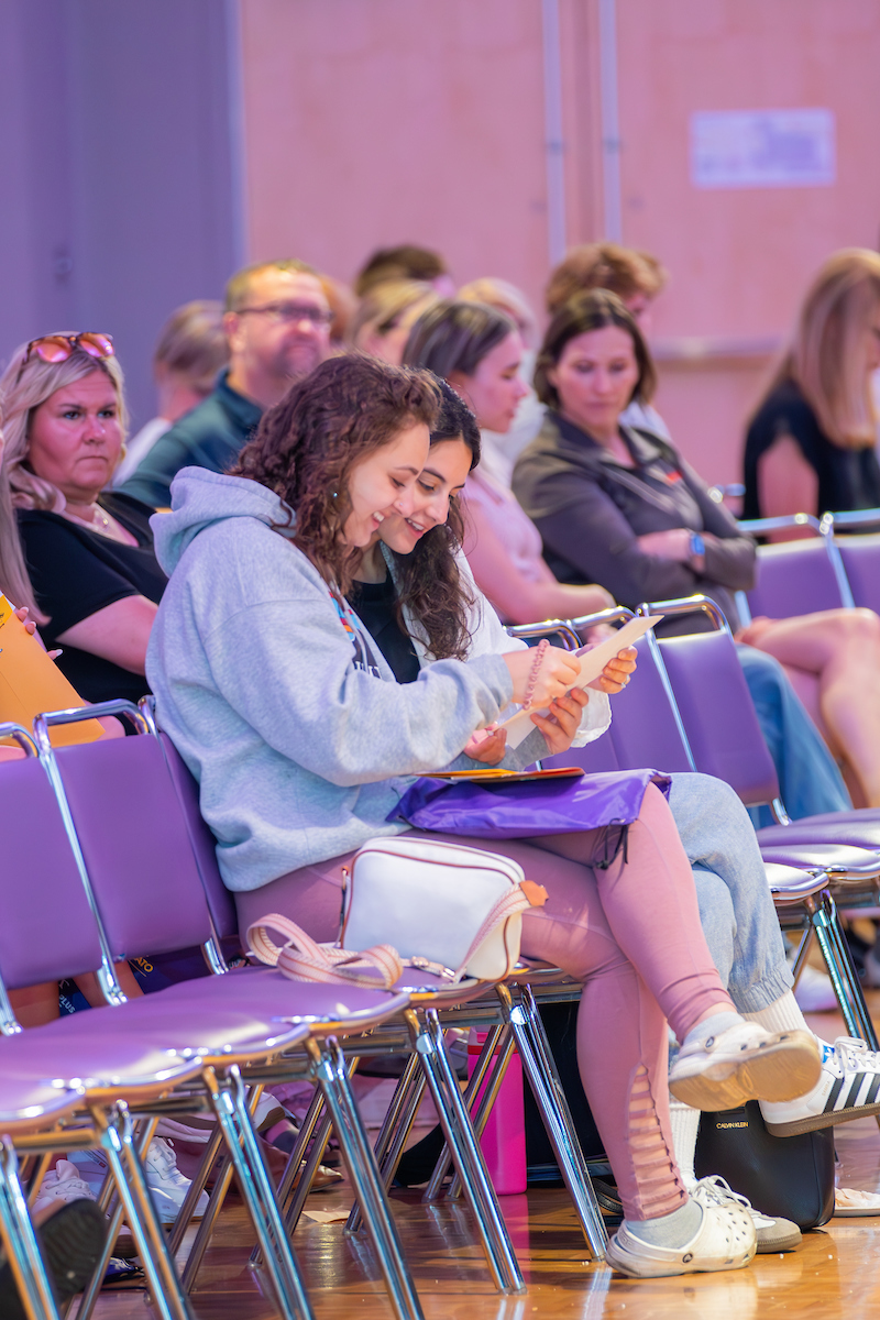 a group of people sitting in chairs