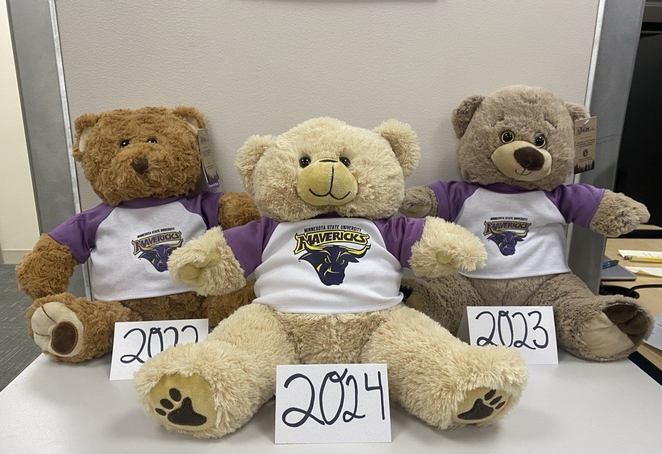 a group of stuffed bears with numbers on them