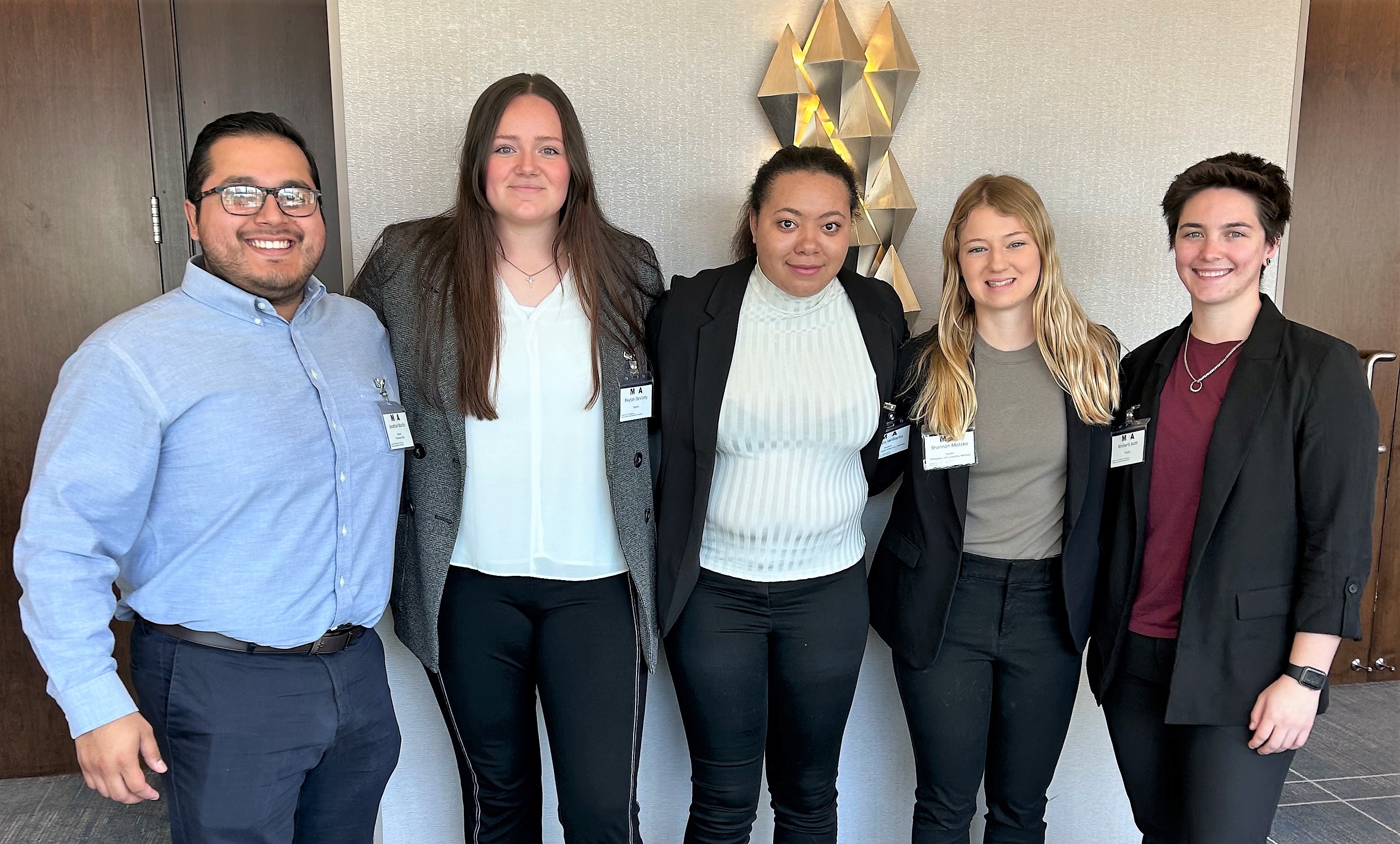 Several Athletic Training students standing together at conference