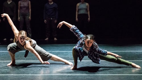 a group of people dancing on a stage