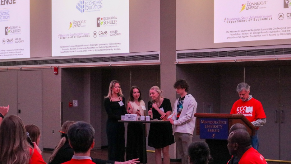 a group of people standing at a podium