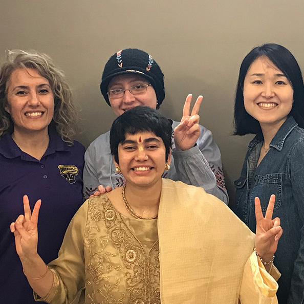 a group of women posing for a photo