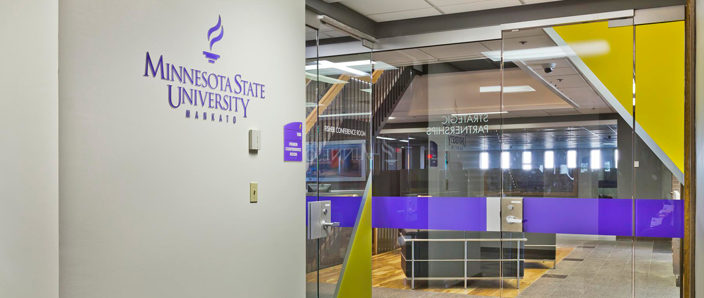 View from inside the Strategic Partnerships office looking through the glass door entrance way