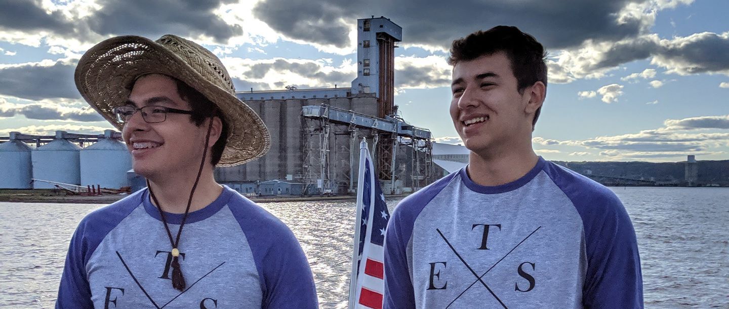 Two ETS students, John and Kurt, posing in front of the Blue Earth River