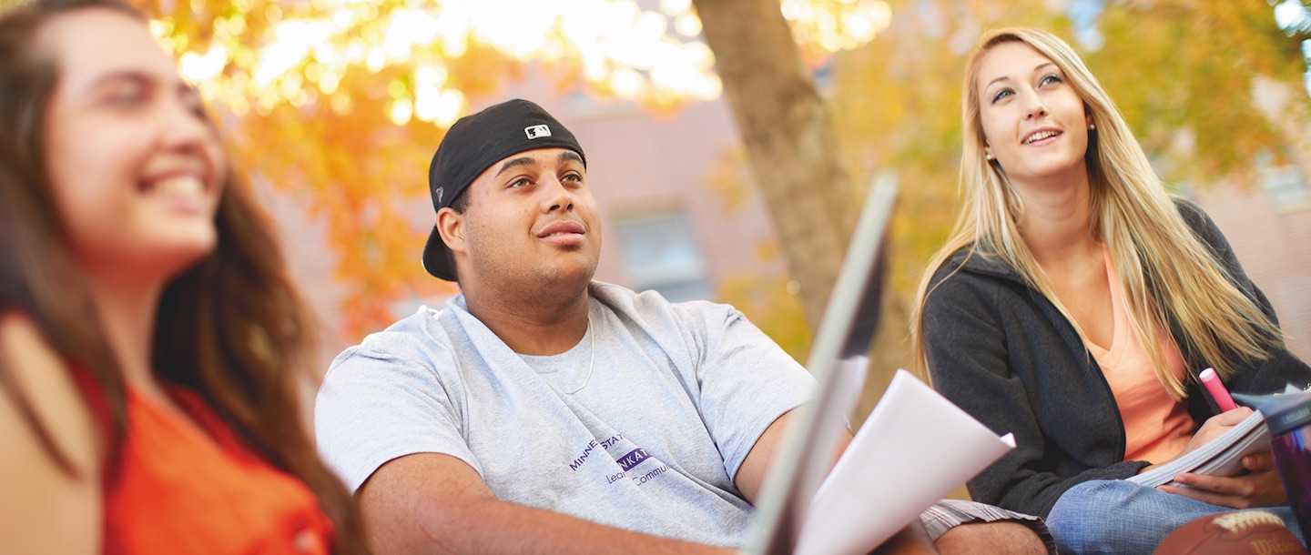 Three Students sitting fall season