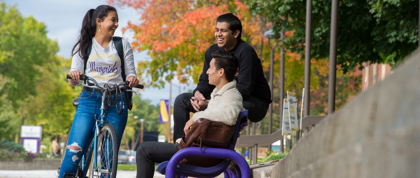 a group of people sitting on a bench