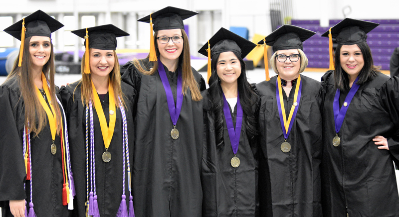 graduates wearing graduation gowns