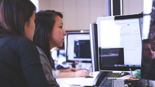 Students collaborating in computer lab