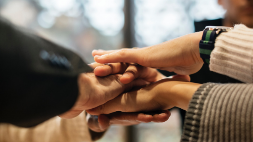 Hands together to celebrate teamwork