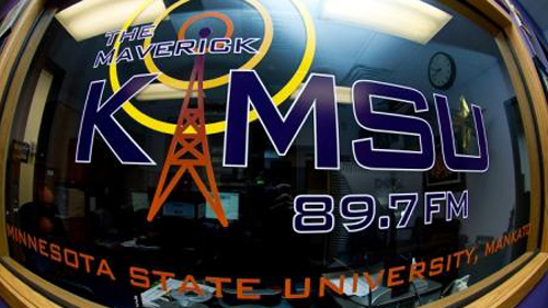 The Maverick KMSU 89.7 FM window sticker on the radio studio window