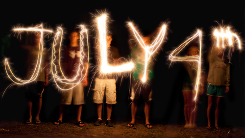 a group of people holding letters