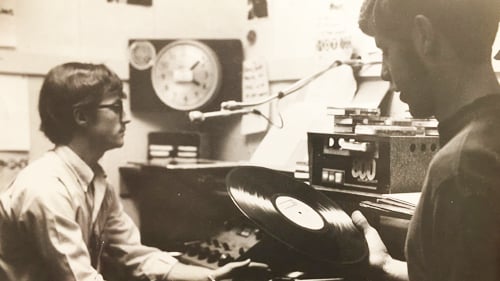 a person holding a record