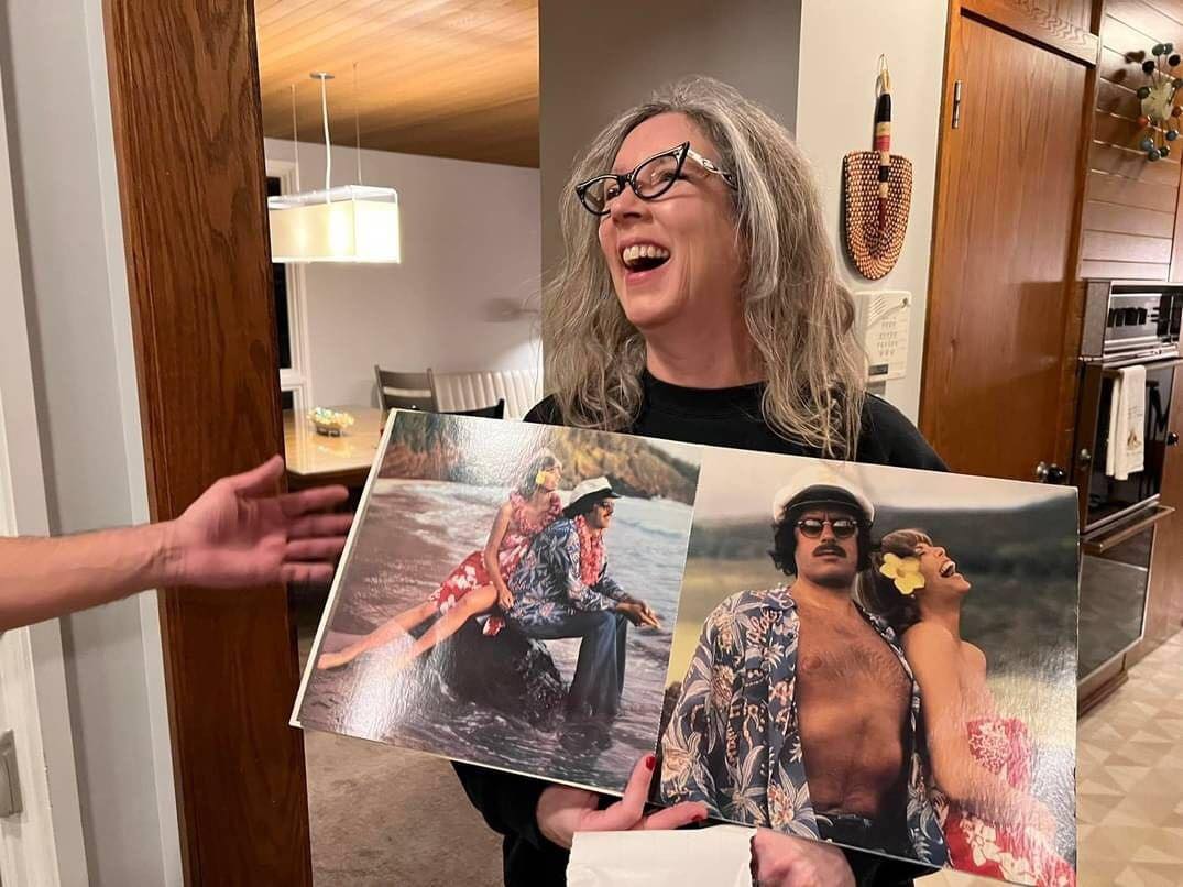 Jen Tiernan (aka Jen X) holding a Captain & Tennille album