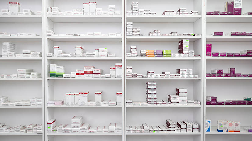 Pharmacy shelves full of medication