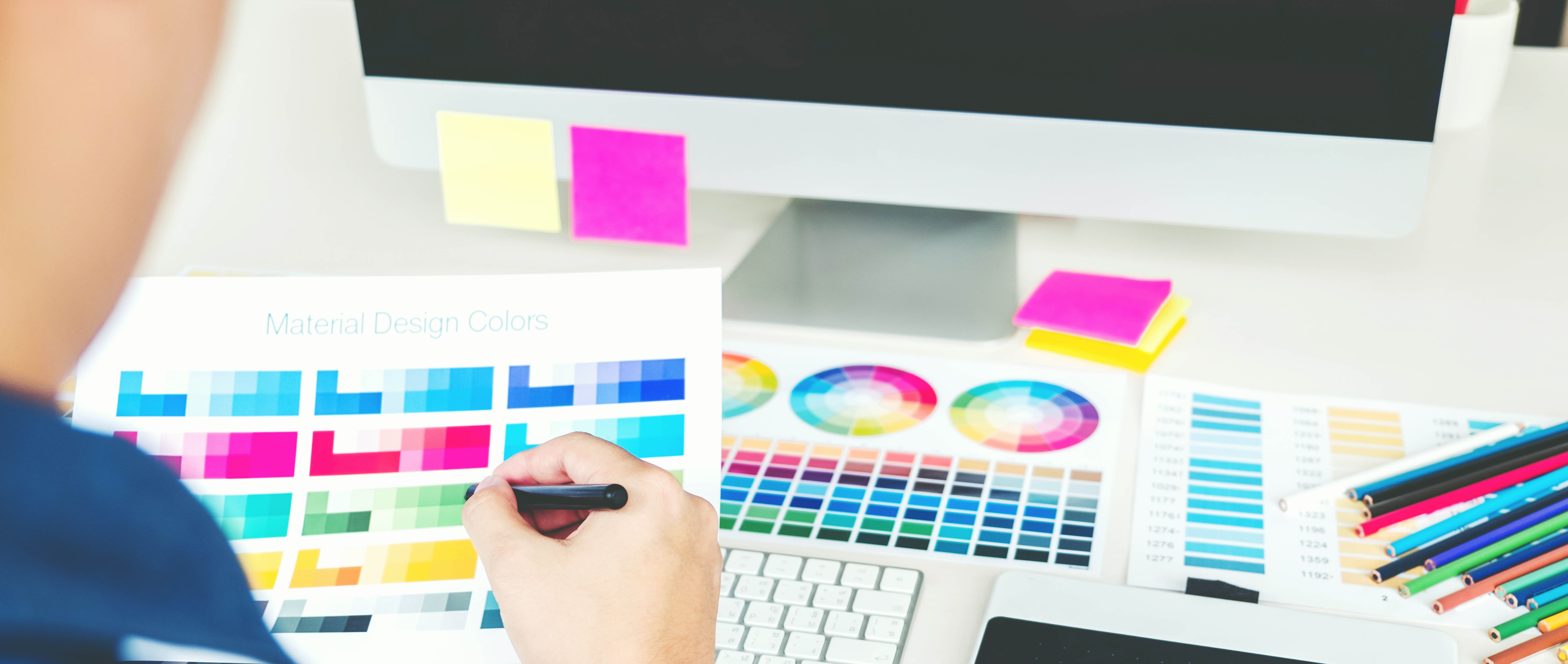 image of a creative desk with color swatches and computer