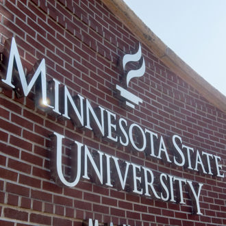 Minneostation State University, Mankato sign hanging outside at the campus entrance 