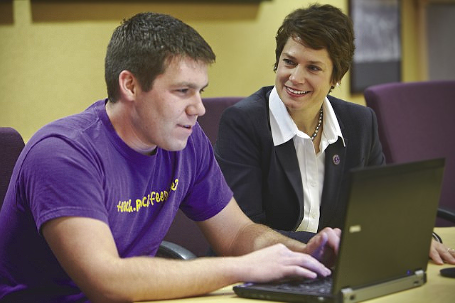 instructor is advising the student in the classroom