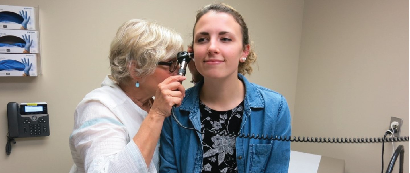 nurse practitioner with female patient