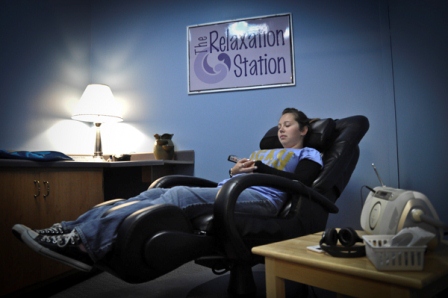 female student relaxing in chair