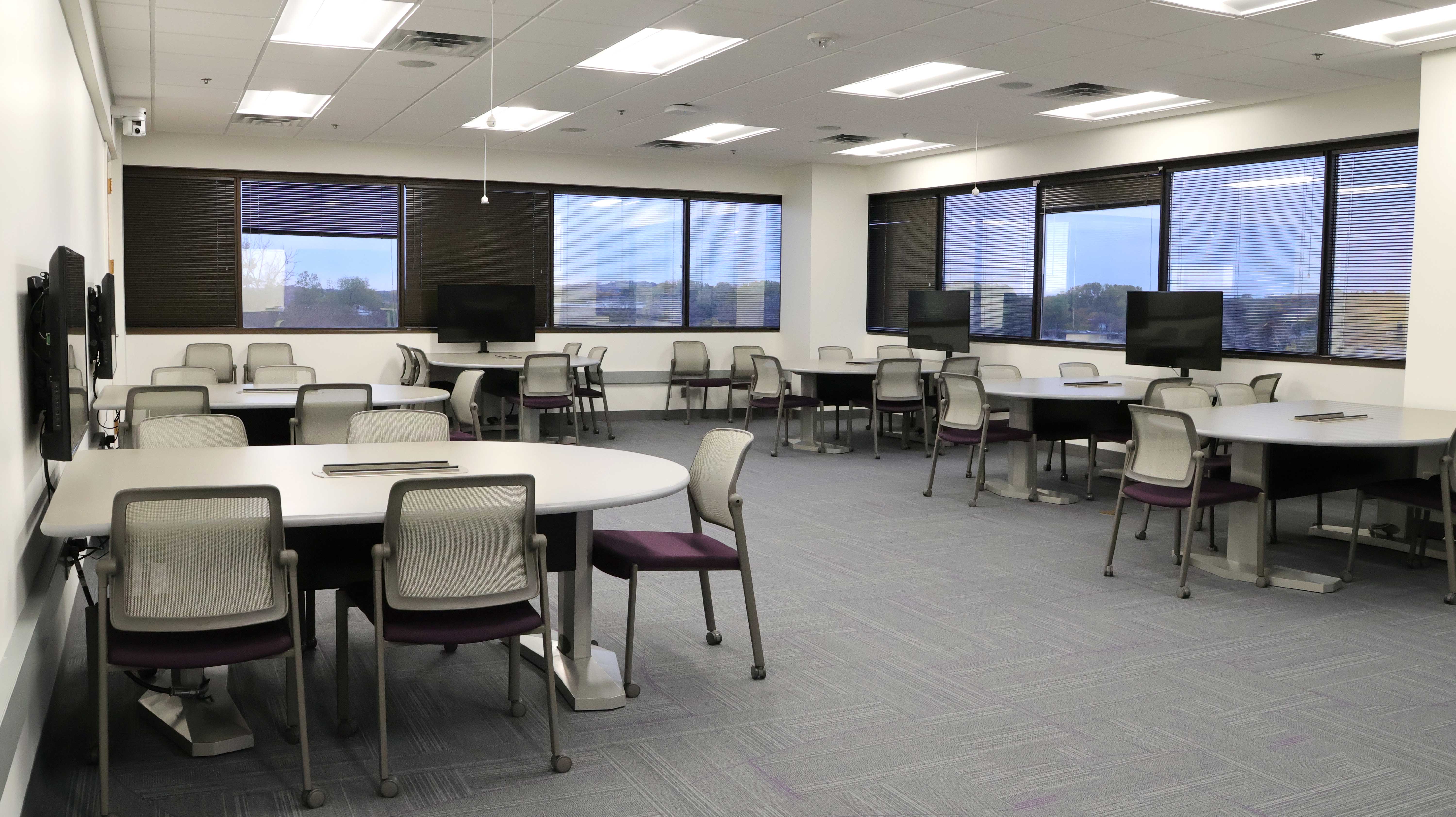 a room with tables and chairs