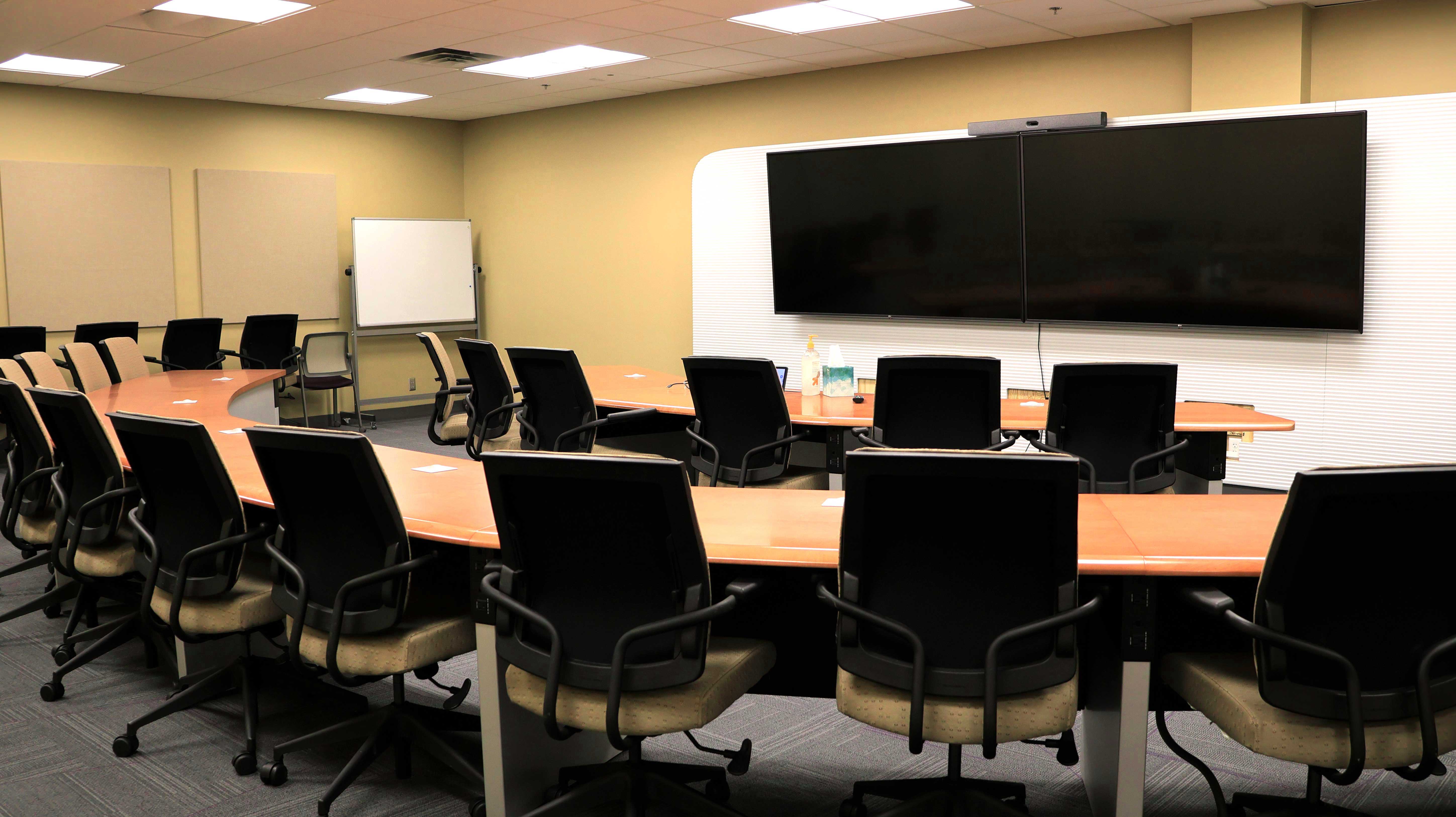 a room with a large table and chairs