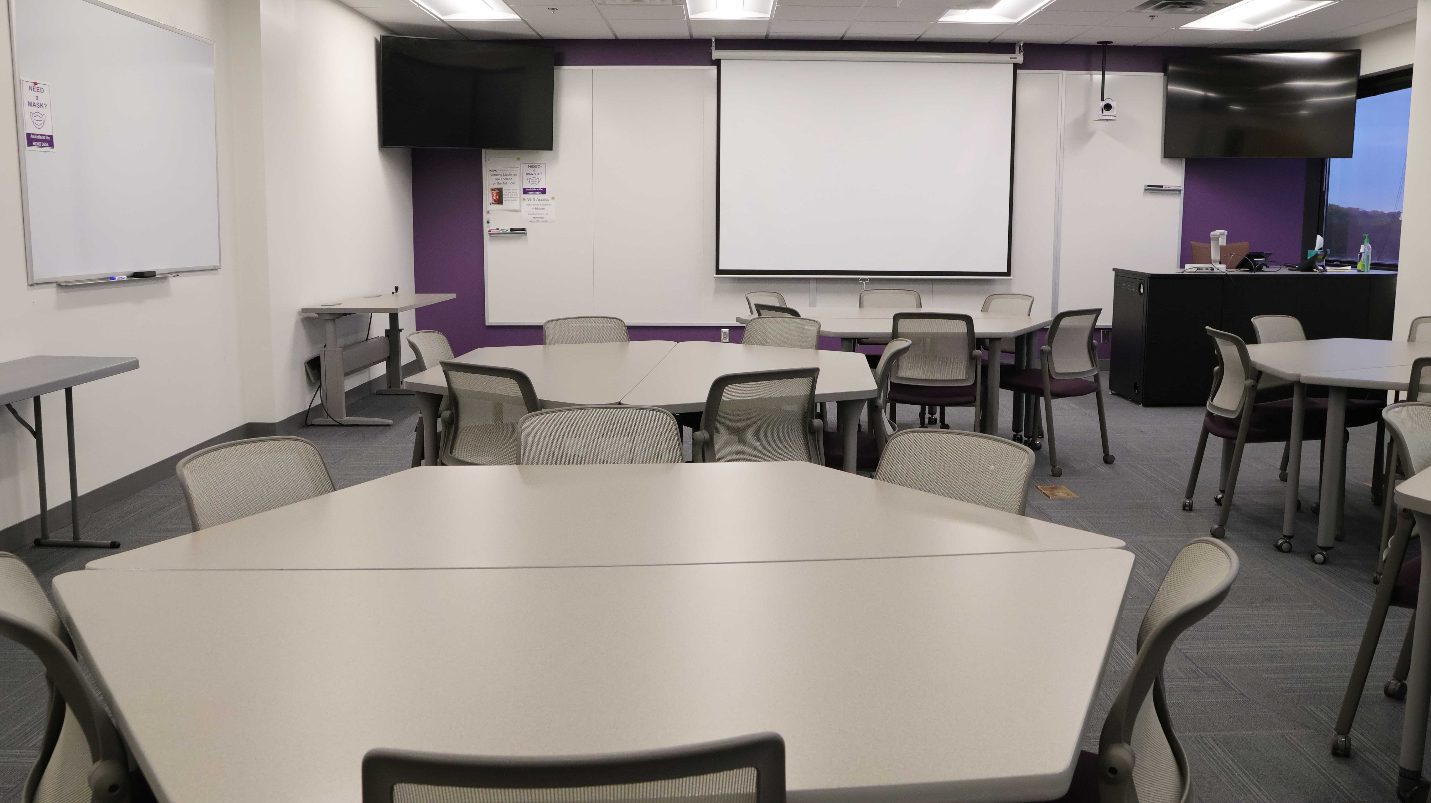 a room with tables and chairs