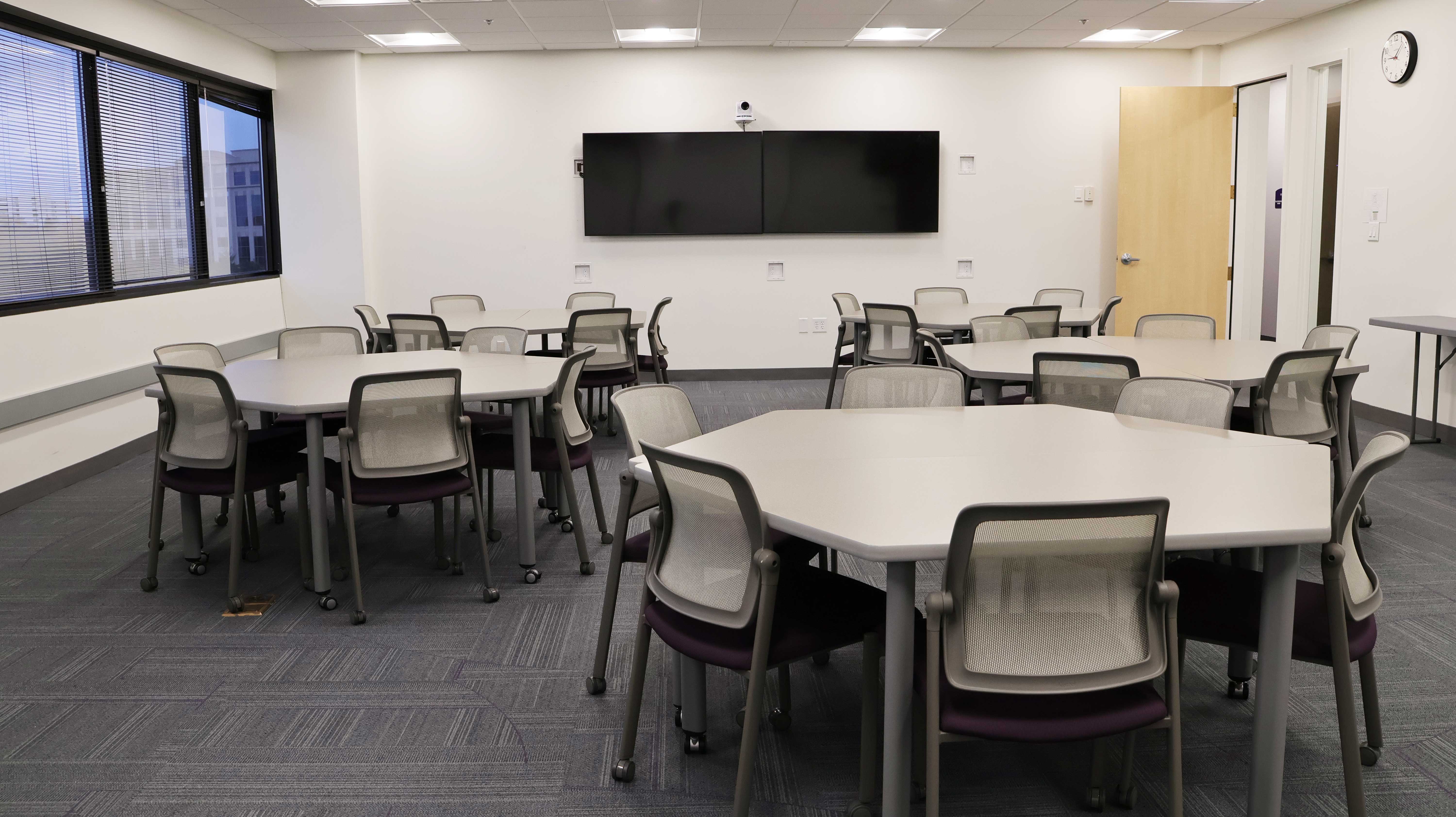 a room with tables and chairs