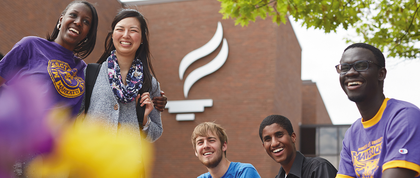 students outside flame group photo