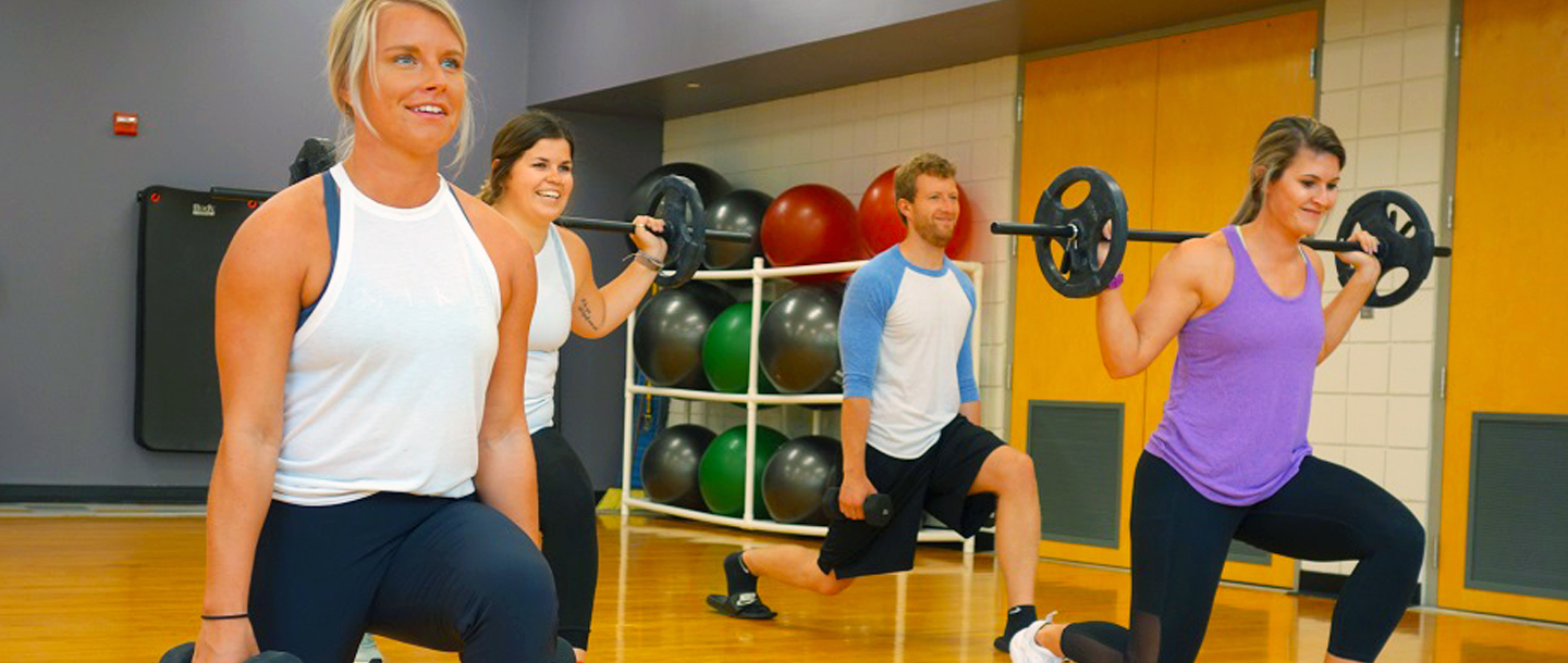 Campus Recreation group of students in exercise lunge class