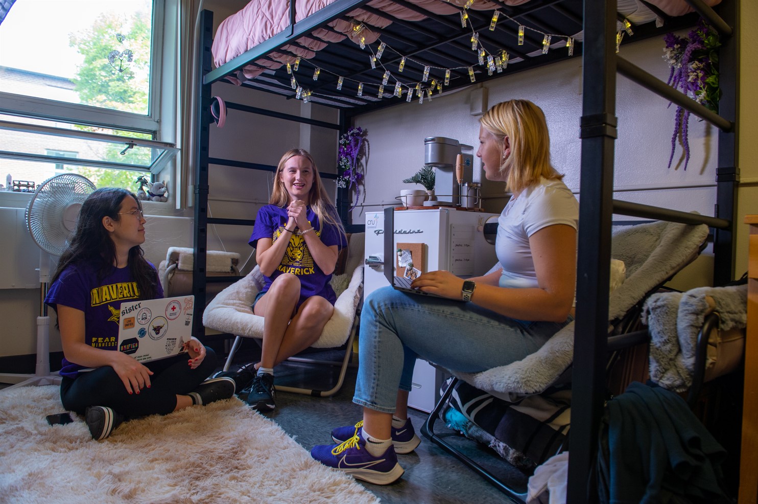 Girls hanging out in their room and talking