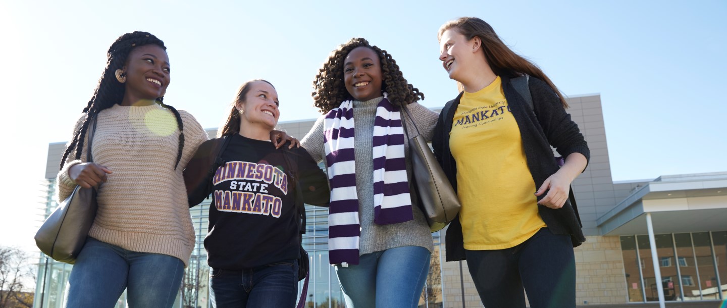 Female students walking together outside