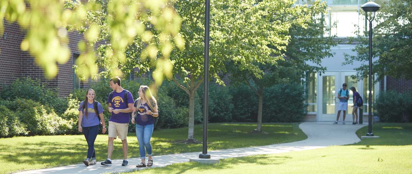 Students walking behind Julia Sears