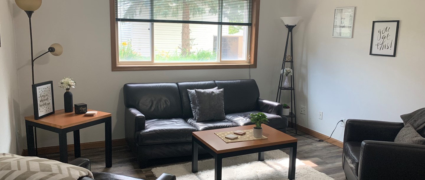 A living room with lamps,  two sofa and somes tables