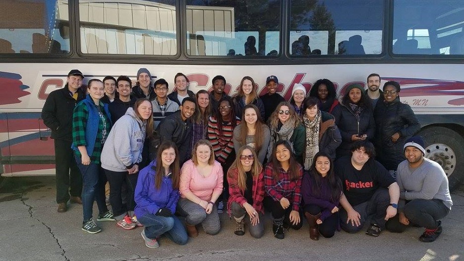 a group of people posing for a photo