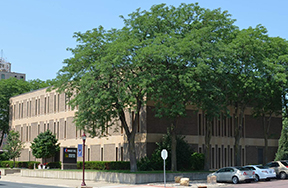 a building with trees in front of it