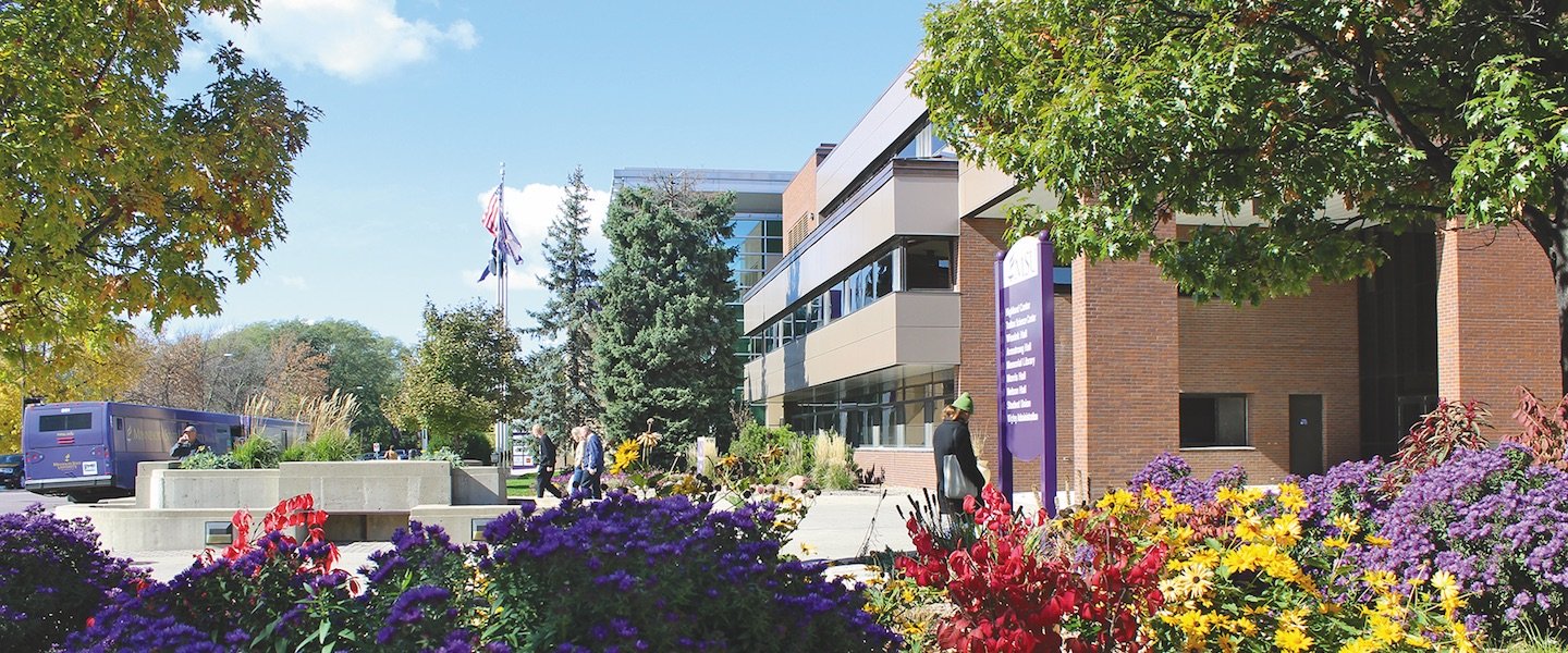 a group of people walking outside a building